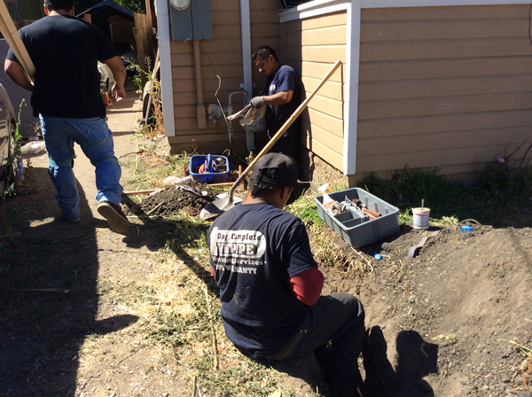 One Day Complete Repipe plumber digging a trench to replace a water line in San Jose